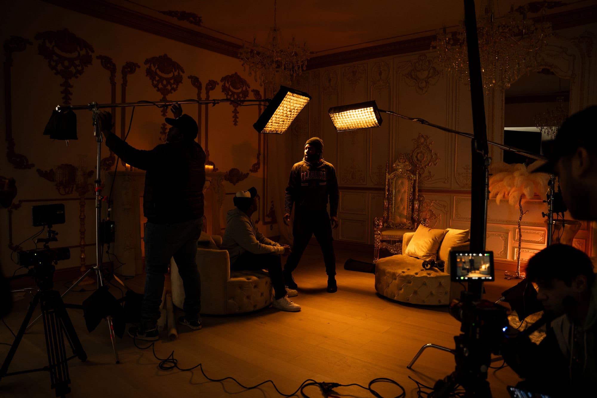 High Arc Media crew lighting a set with LED panels during a shoot