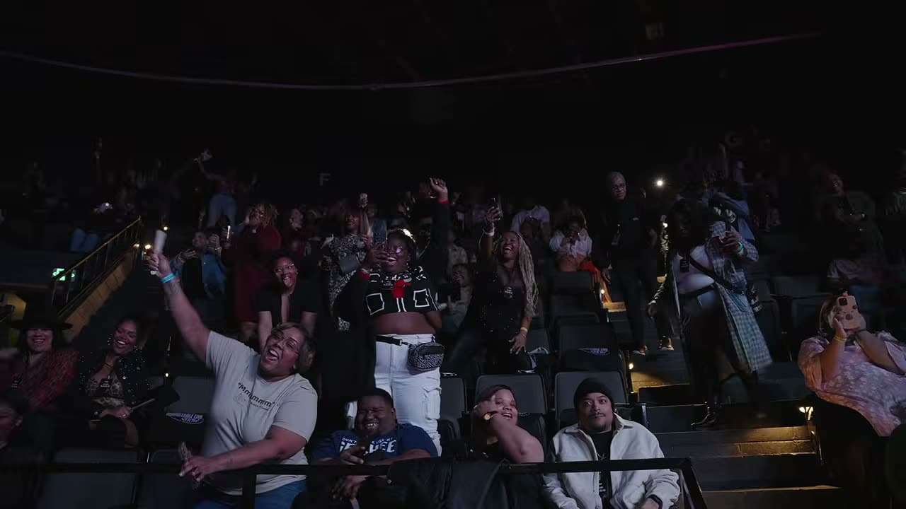 The Atlanta audience mid-laugh, phones up